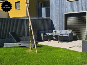 Zahrada ubytování Ferienhausträume - ebenerdiges Bodensee Apartment mit Garten und großer Terrasse mit Grill