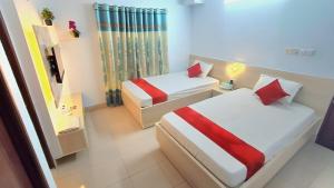 En eller flere senge i et værelse på Hotel Lynn Valley, Delux Non AC Double Bed