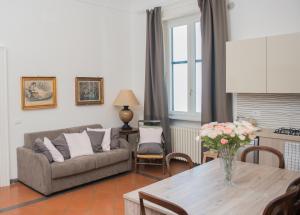 a living room with a couch and a table at Casa Beatrice Amalfi Coast in Vietri sul Mare
