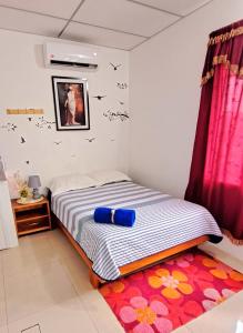 Ένα ή περισσότερα κρεβάτια σε δωμάτιο στο MAEN k