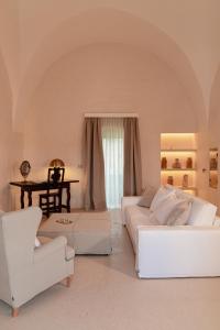 Ένα ή περισσότερα κρεβάτια σε δωμάτιο στο Masseria Eirene