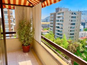 a balcony with a view of a city at sanhatan in Santiago