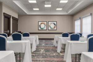 a conference room with white tables and blue chairs at Homewood Suites by Hilton Burlington in Burlington +51 photos