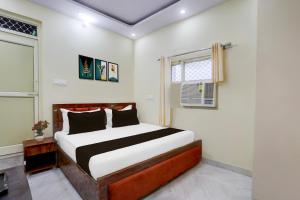 Ένα ή περισσότερα κρεβάτια σε δωμάτιο στο Hotel O Sangat Prime