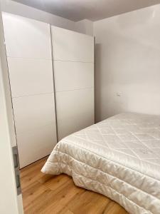 Ένα ή περισσότερα κρεβάτια σε δωμάτιο στο Suite Fortuna