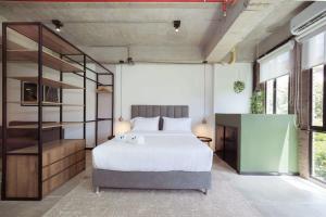 Ένα ή περισσότερα κρεβάτια σε δωμάτιο στο Enchanted Elegance in Laureles