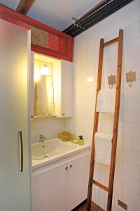 a bathroom with a sink and a ladder at La casa dei Giardini, Bioglio in Bioglio +50 photos