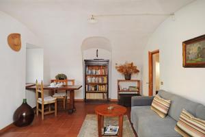 a living room with a couch and a table at La casa dei Giardini, Bioglio in Bioglio