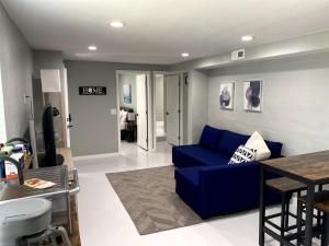 a living room with a blue couch and a table at E 1st Back Casita in Tucson