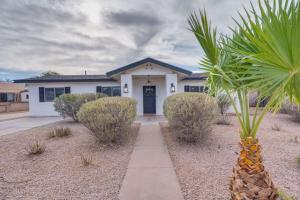 a palm tree in front of a house at Parkway Terrace in Tucson