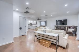 a living room with a white couch and a table at Parkway Terrace in Tucson