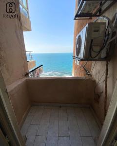 a view of the ocean from a room with a microwave at Alex inn Rooms in Alexandria