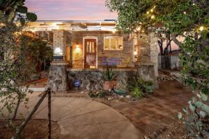a brick house with a patio in front of it at N 1st Ave in Tucson