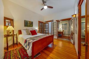 a bedroom with a bed and a ceiling fan at N 1st Ave in Tucson