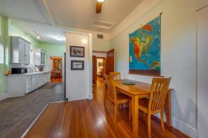 a dining room with a table and a map on the wall at N 1st Ave in Tucson