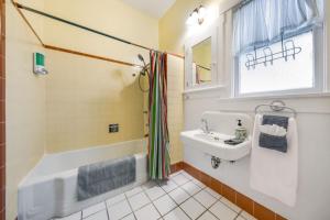 a bathroom with a tub and a sink at N 1st Ave in Tucson +20 photos