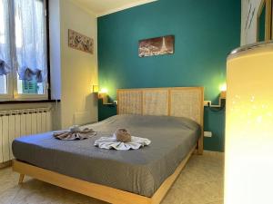 Ένα ή περισσότερα κρεβάτια σε δωμάτιο στο Cuore di Cairo - Bilocale vicino al centro storico