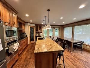 a kitchen with a table and a dining room at Leavenworth Mountain, Golf Course, 3br 4 ba in Leavenworth