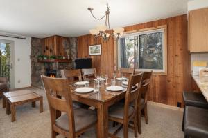 a dining room with a wooden table and chairs at Beaver Village Unit #0724 in Winter Park