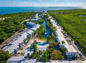 an aerial view of a resort with a river at Beautiful Key Largo Escape Pool, Tennis & Marina in Key Largo