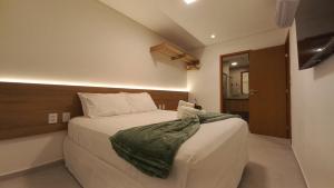 En eller flere senge i et værelse på Cond Pe na Areia com Piscina Privativa + 10 billeder