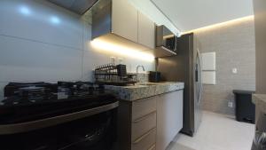 Køkken eller tekøkken på Cond Pe na Areia com Piscina Privativa