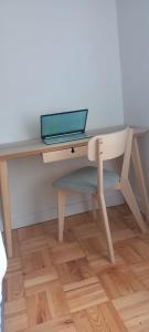 a desk with a laptop computer on top of it at Lavanda Termas de São Pedro do Sul in Termas de Sao Pedro do Sul +9 photos