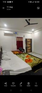 a bedroom with a large bed in a room at Manglam House in Ayodhya