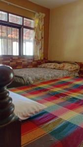 Ένα ή περισσότερα κρεβάτια σε δωμάτιο στο Casa Alquimia - La Casona