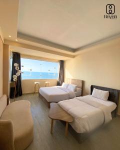 Ένα ή περισσότερα κρεβάτια σε δωμάτιο στο Alex inn Rooms