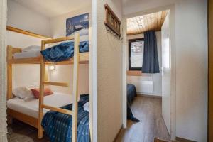 a small room with a bunk bed and a room with a bunk bed at Ski-in Chalet-Style View Flat - Résidence les Eterlous in Val Thorens