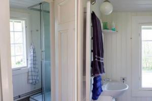 a bathroom with a sink and a toilet and a shower at STO754-Graeddoe-Maroe-1 in Gräsken