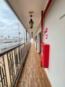 a balcony with a view of the beach at Hotel Inter Alexandria in Cândido Mota