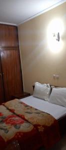 Ένα ή περισσότερα κρεβάτια σε δωμάτιο στο APPARTEMENT VICTOIRE omnisport