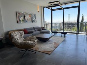 a living room with a couch and a table at Chic & Cozy Designer Space 1A in Addis Ababa