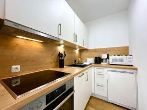 Kuchyň nebo kuchyňský kout v ubytování Nesthäkchen, Montana Haus