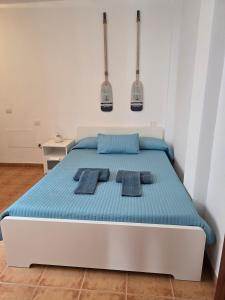 En eller flere senge i et værelse på Apartamento Azul