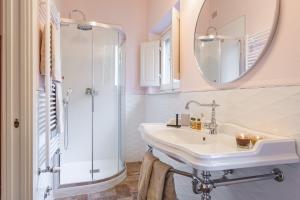 a bathroom with a sink and a shower at Dimora Vecchio Duomo - Together in Tuscany in Cortona