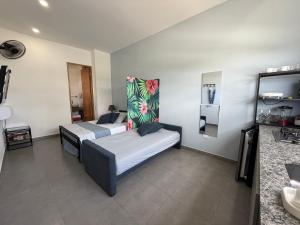 Ένα ή περισσότερα κρεβάτια σε δωμάτιο στο Atardeceres casa de playa