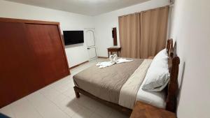 Postel nebo postele na pokoji v ubytování Casa Eva