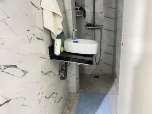 a bathroom with a sink and a shower at Agdal apart in Rabat