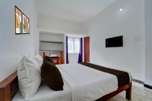 Μια τηλεόραση ή/και κέντρο ψυχαγωγίας στο Hotel O Muthalipalayam Bus Stand Coimbatore Formerly Haven Stays +23 φωτογραφίες