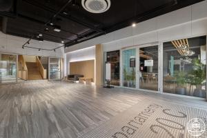 an empty room with a wooden floor in a building at Apartments M&M, GRATIS parking, basen, sauna, siłownia in Kołobrzeg +96 photos