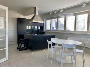 Køkken eller tekøkken på Kattohuoneisto terassilla 93 m2