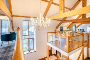 a dining room and kitchen with a chandelier at 6 Bed in Blaencwm oc-t32688 in Blaencwm