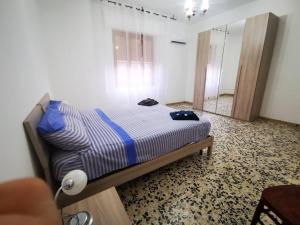 Ένα ή περισσότερα κρεβάτια σε δωμάτιο στο Casa Bonaria