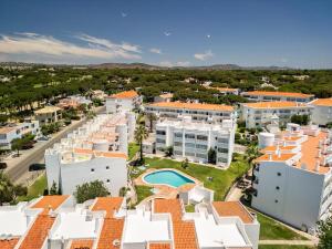 an aerial view of the buildings of a resort at Manelinha Apartment - cozy apartment with pool and beach in Quarteira +1 photo
