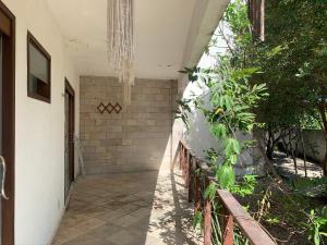 a hallway of a house with a fence at Apto em Condomínio Brisas do Amor in Pipa