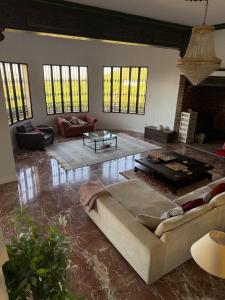 a living room with a couch and a table at Bronlara in Alhaurín de la Torre