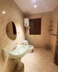 Ένα μπάνιο στο Alex inn Rooms